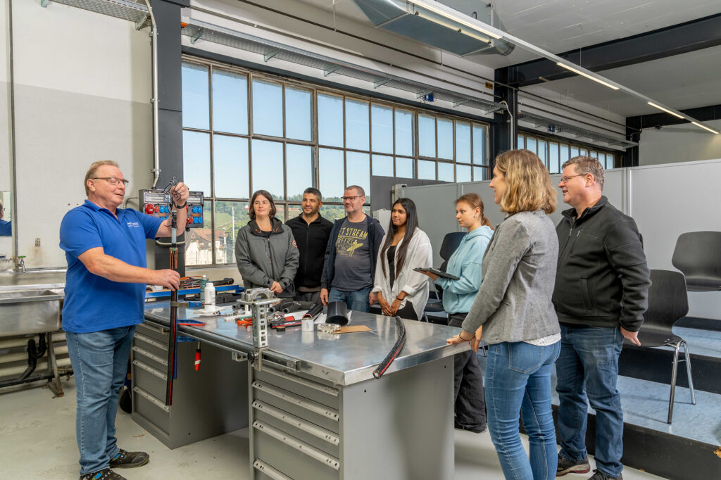 Training session at Brugg Cables Academy with participants learning cable installation techniques