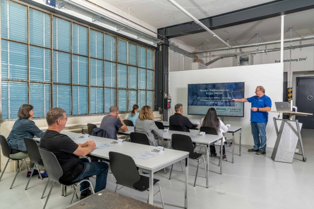 Technical training course at Brugg Cables Academy with participants attending a cable systems presentation