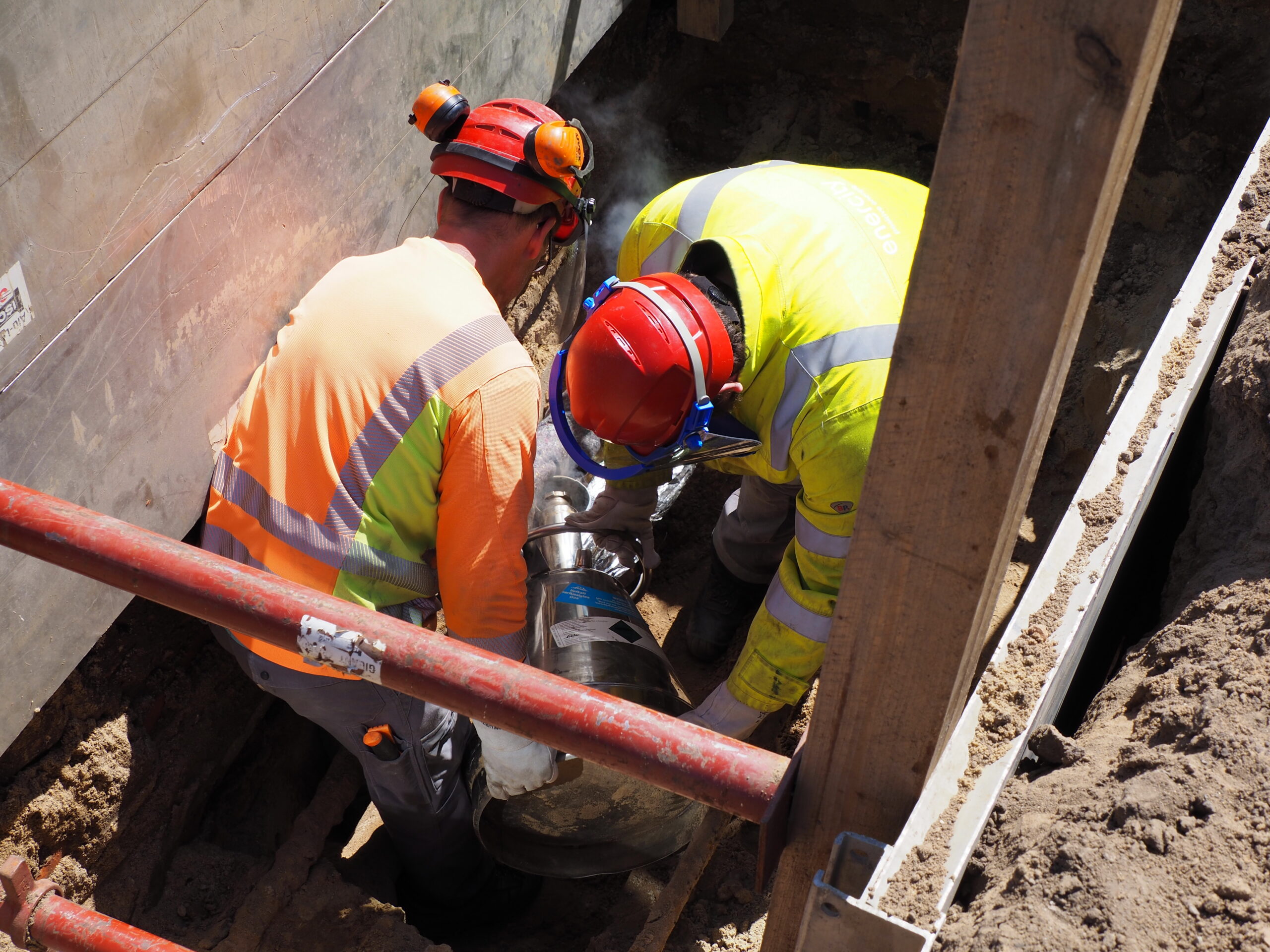 Emergency Response Solutions for cable systems 1 Brugg Cables field technicians performing emergency repair on underground power cable in excavated trench